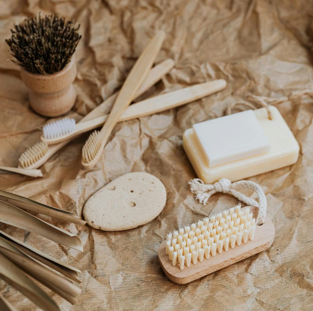 Collection of natural bath products on a rustic brown paper background, emphasizing sustainability.