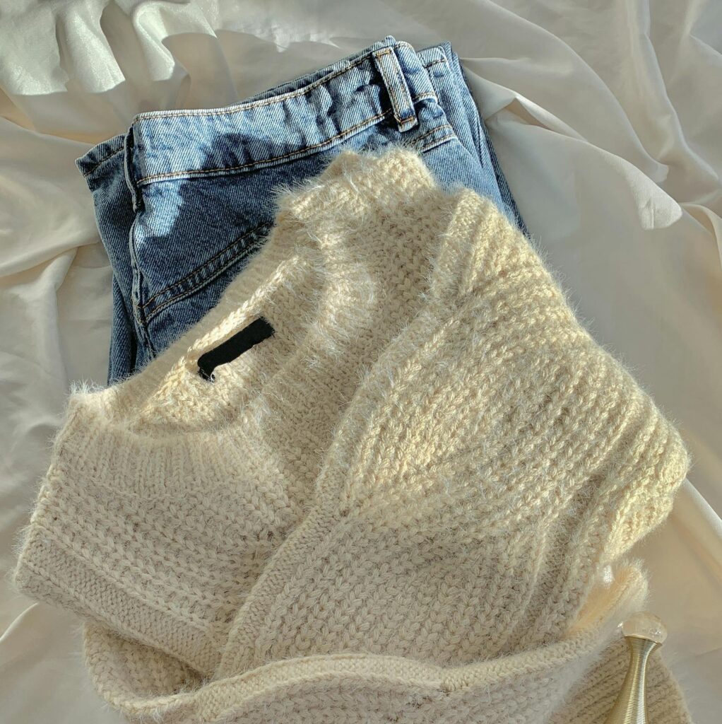 Warm wool sweater paired with classic blue jeans for a cozy winter look.