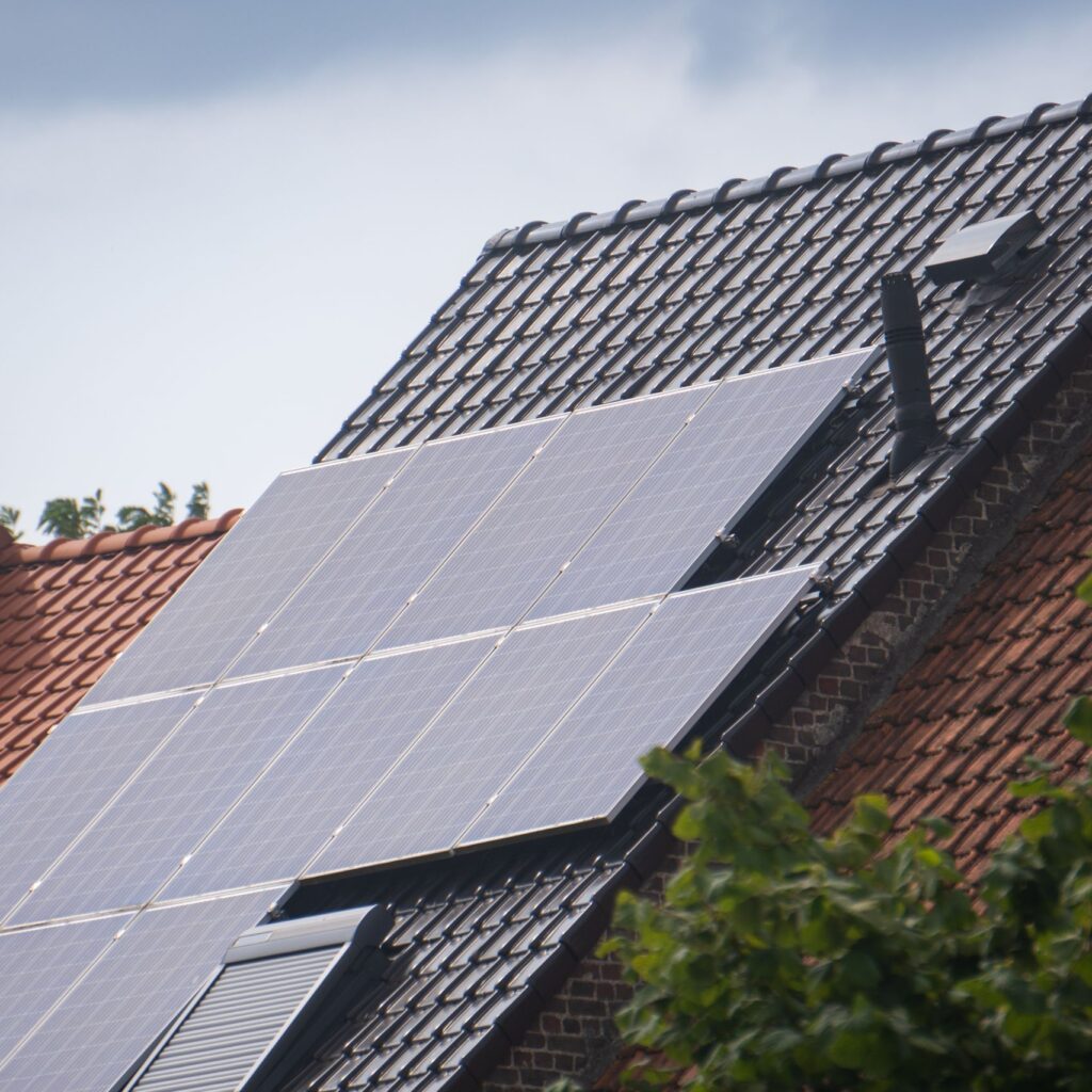 Solar panels installed on a residential rooftop, showcasing eco-friendly renewable energy solutions.